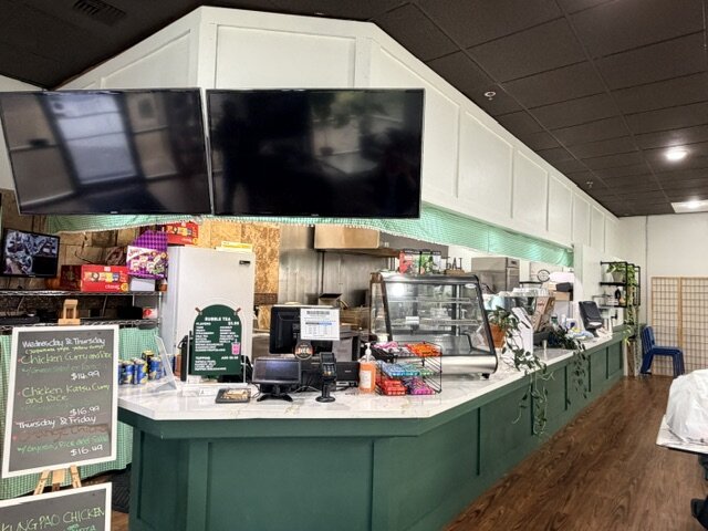 The service counter and overhead menu boards.
