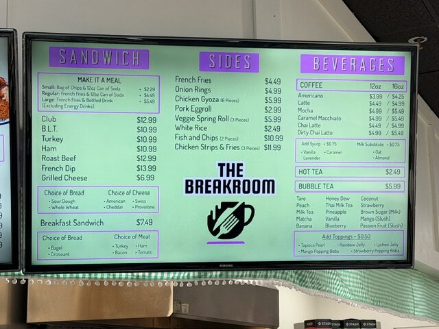 In-store menu board — sandwiches, sides, beverages.