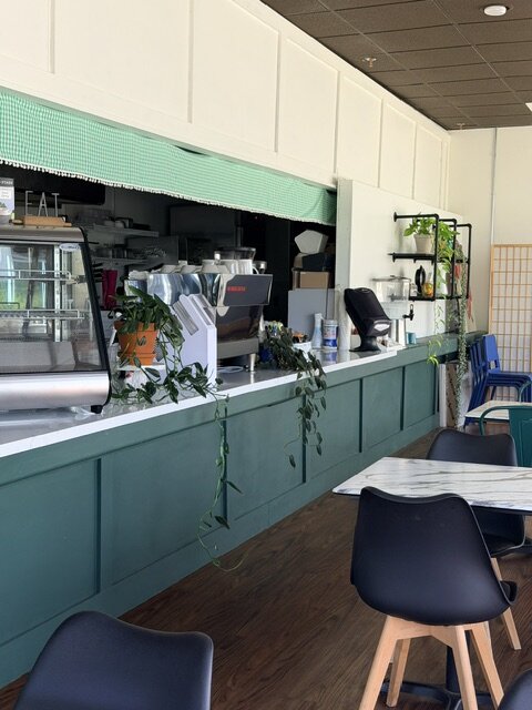 Behind the counter — the prep area.